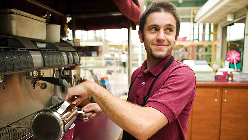 Barista making cup of coffee.