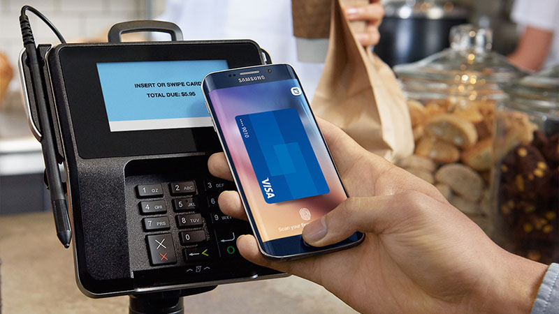 phone paying contactless in cafe